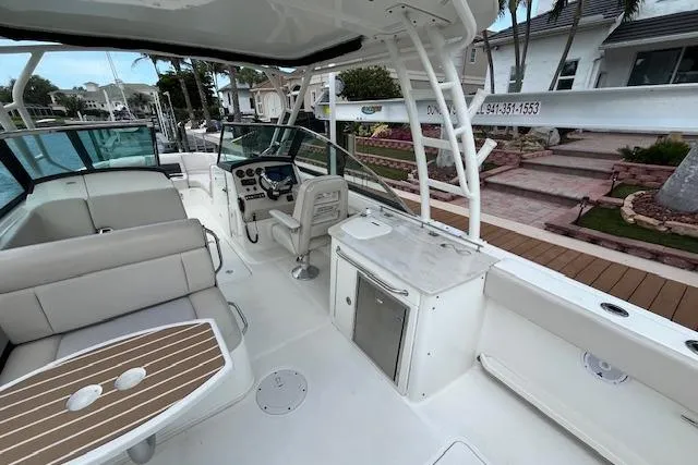 Slide: The Image of 2015 Boston Whaler 270 Vantage boat interior with seating and helm station. - 23