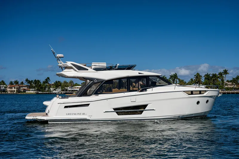Slide: The Image of Greenline 45 Fly Yacht 2022 on calm waters under sunny skies. - 12