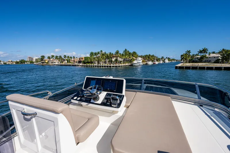 Slide: The Image of Greenline 45 Fly 2022 on water with palm trees in background. - 42
