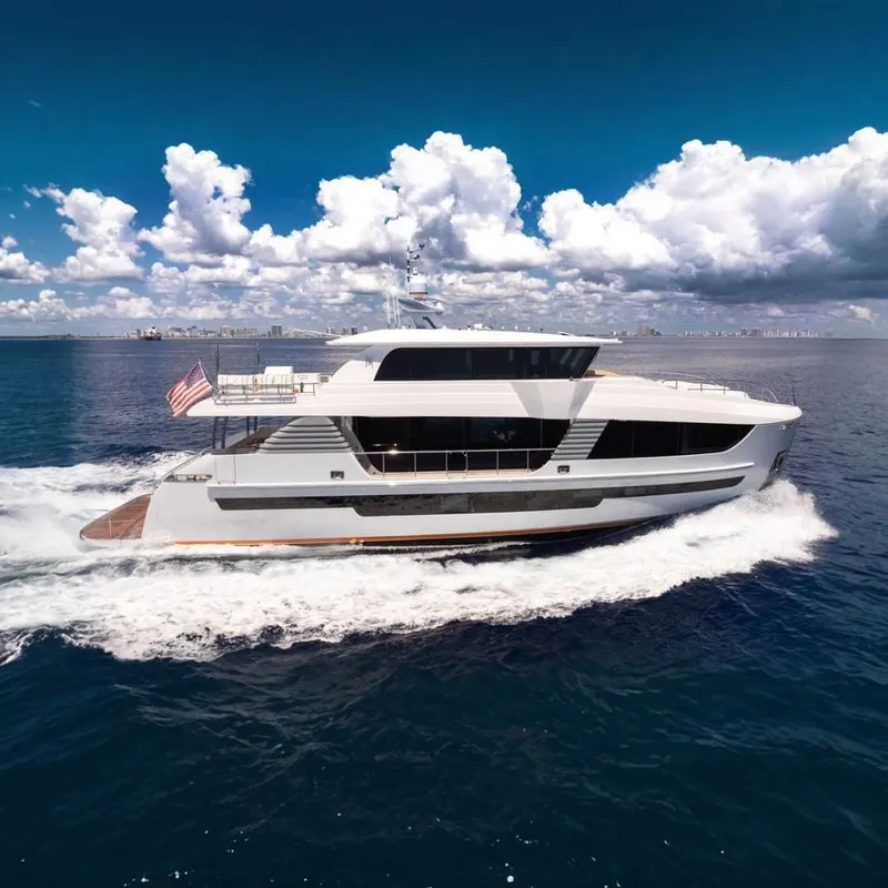 The Image of Luxurious 2020 Hargrave C92 yacht cruising on open sea under a vibrant sky. - 0