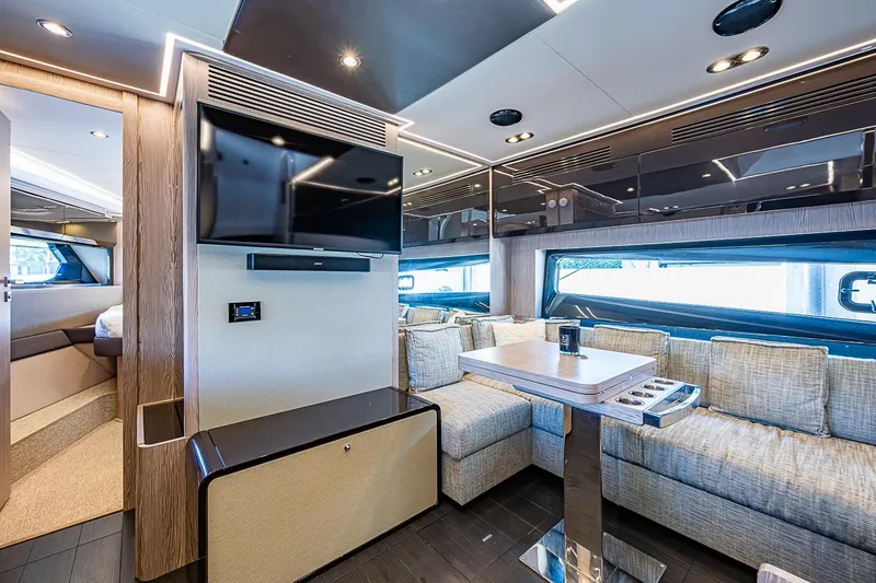 Slide: The Image of Luxurious interior of 2019 Azimut Atlantis 51 yacht with modern seating and entertainment area. - 36