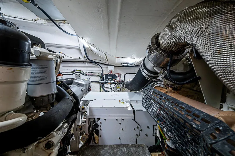 Slide: The Image of Engine room of 2019 Azimut Atlantis 51 yacht, showcasing mechanical components and piping. - 60