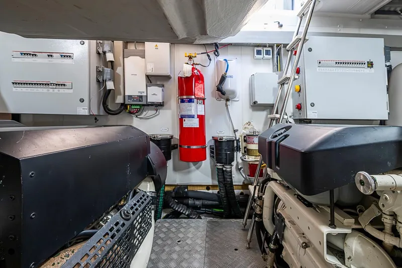 Slide: The Image of Engine room of 2019 Azimut Atlantis 51 yacht with fire extinguisher and control panels. - 66