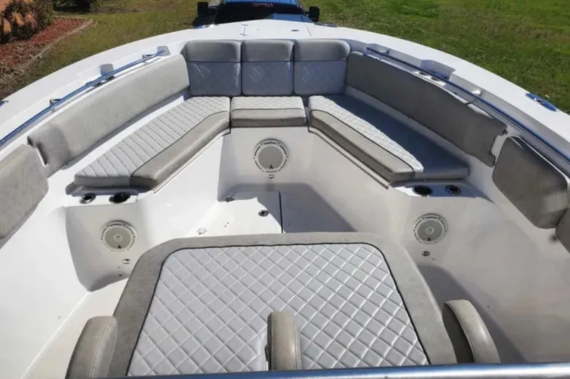 Slide: The Image of 2019 Sea Fox 328 Commander boat interior with cushioned seating and speakers. - 3