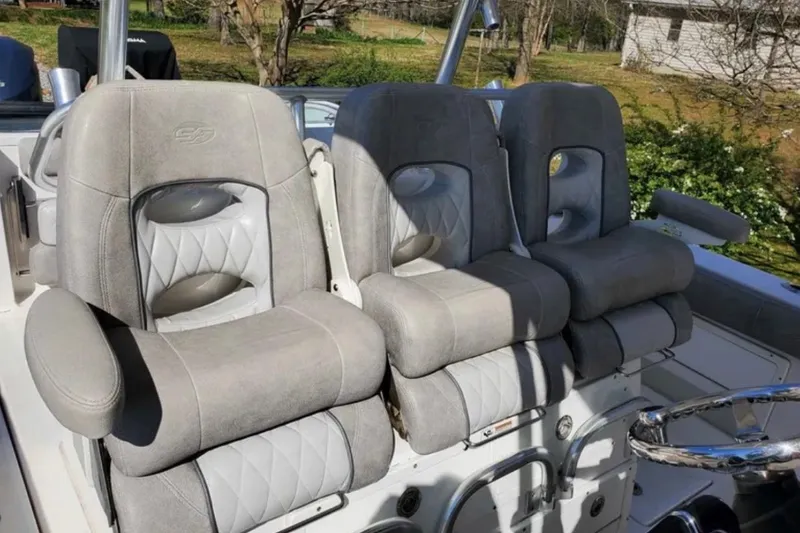 Slide: The Image of Luxurious seating on a 2019 Sea Fox 328 Commander boat, featuring plush gray upholstery. - 5