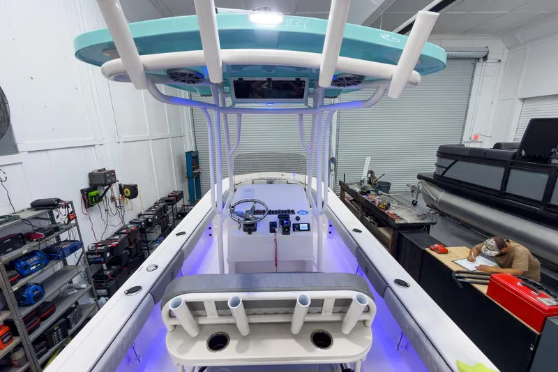 Slide: The Image of Interior view of a 2026 Carolina Skiff 24 Ultra Elite boat in a workshop. - 15