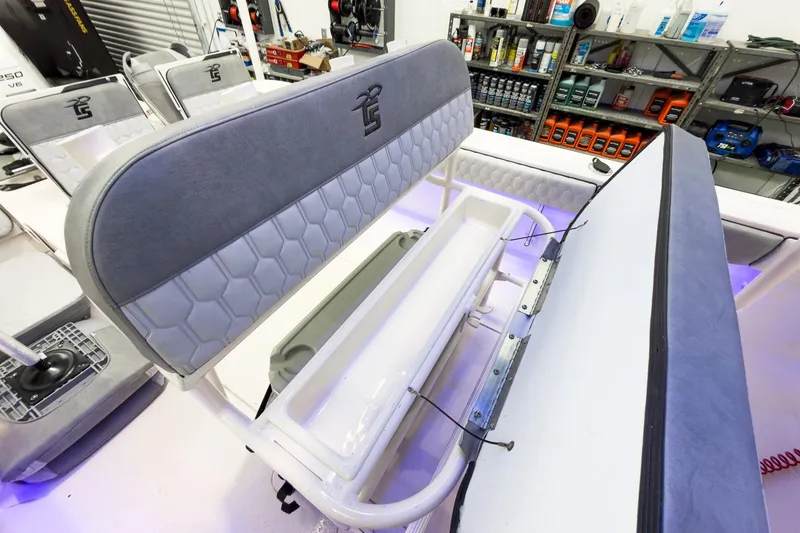 Slide: The Image of Interior of 2026 Carolina Skiff 24 Ultra Elite with seating and storage. - 17