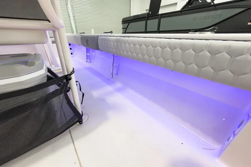 Slide: The Image of Interior of 2026 Carolina Skiff 24 Ultra Elite with blue LED lighting. - 39