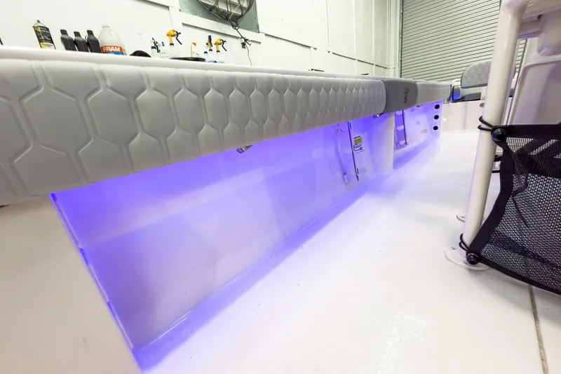Slide: The Image of Interior view of 2026 Carolina Skiff 24 Ultra Elite with blue LED lighting. - 40
