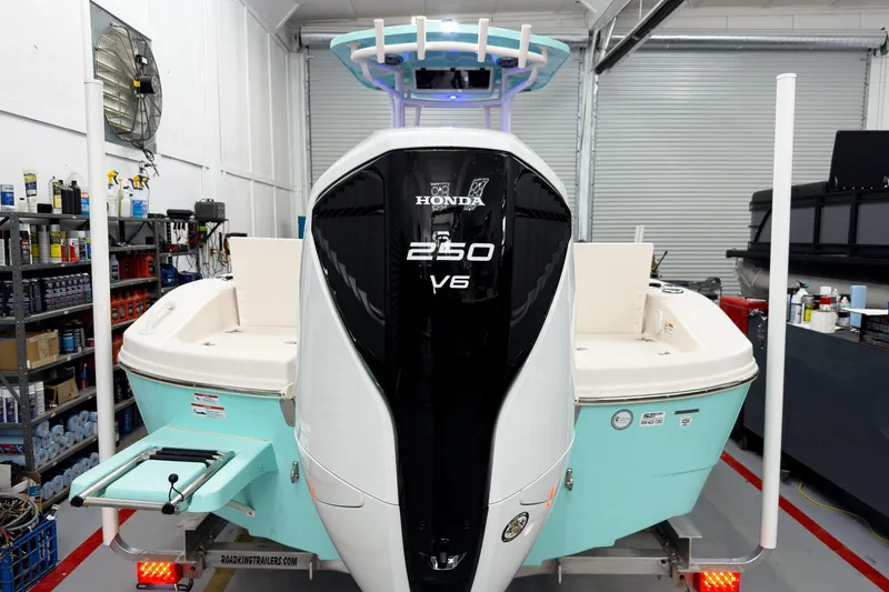 The Image of Carolina Skiff 24 Ultra Elite 2026 with Honda 250 V6 engine in workshop. - 5