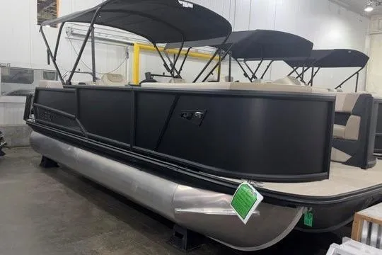 The Image of 2026 Alera A22Q pontoon boat with black exterior and canopy in showroom. - 0