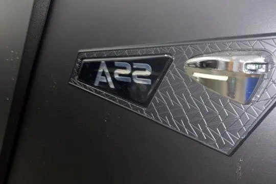 Slide: The Image of Close-up of Alera A22Q 2026 model emblem on textured surface. - 11