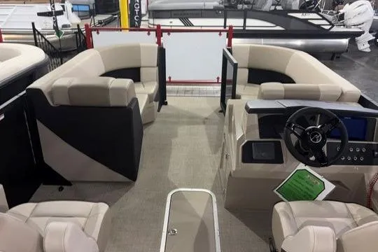 Slide: The Image of Interior of 2026 Alera A22Q boat with beige seating and modern dashboard. - 3