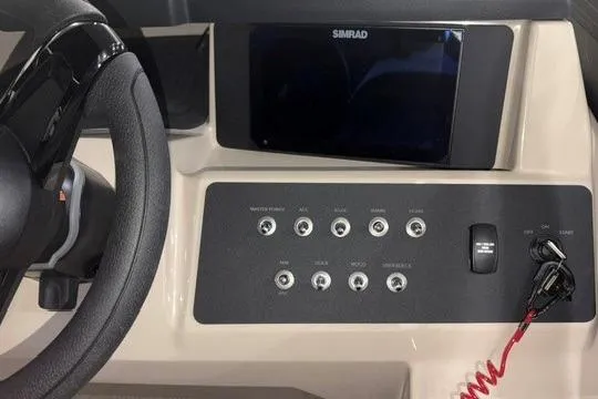 Slide: The Image of Dashboard of 2026 Alera A22Q boat with steering wheel and control panel. - 4