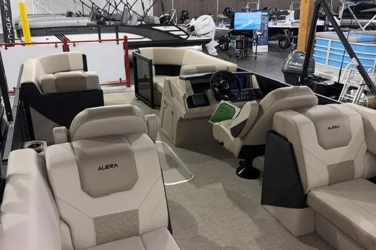 Slide: The Image of Luxurious interior of 2026 Alera A22Q boat with plush seating and modern dashboard. - 7