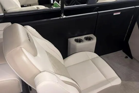 Slide: The Image of Luxury seating in 2026 Alera A22Q boat with cup holders and beige upholstery. - 9