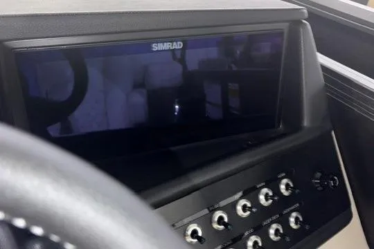Slide: The Image of Dashboard of 2026 Alera Marine M23Q with Simrad display and control panel. - 10
