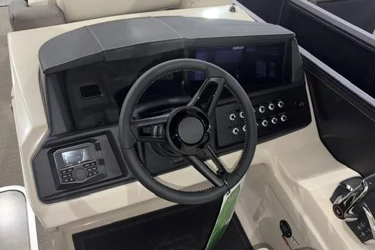 Slide: The Image of Steering console of 2026 Alera Marine M23Q boat with modern controls and dashboard. - 9