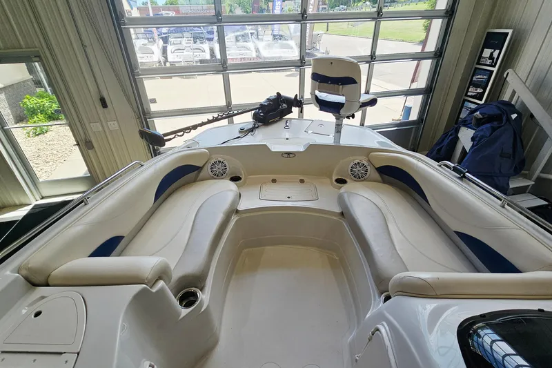 Slide: The Image of Interior view of a 2012 Tahoe 215 Xi boat with spacious seating and modern design. - 12