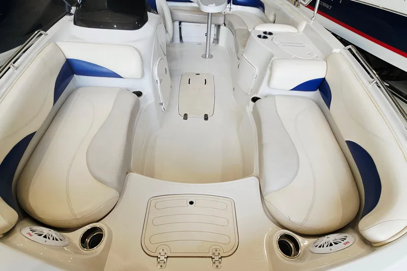 Slide: The Image of Interior of a 2012 Tahoe 215 Xi boat with white and blue seating. - 13