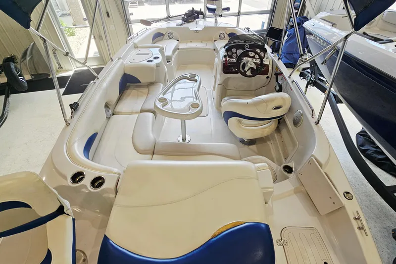 Slide: The Image of Interior of a 2012 Tahoe 215 Xi boat with seating and steering console. - 6