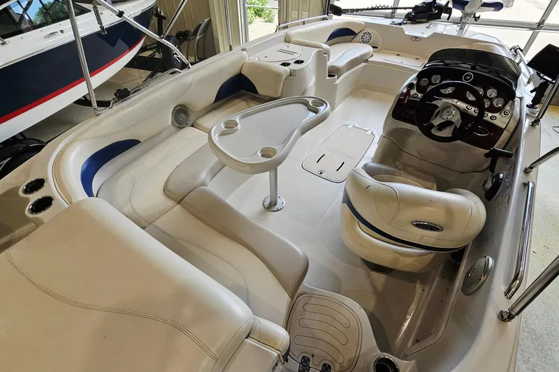 Slide: The Image of Interior of a 2012 Tahoe 215 Xi boat with seating and steering console. - 7