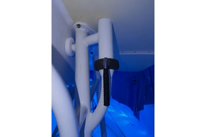Slide: The Image of Close-up of a 2005 Regulator 32 Forward Seating boat's structural detail with blue lighting. - 11