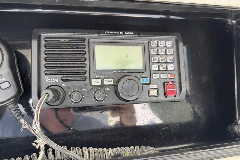 Slide: The Image of VHF marine radio on a 2005 Regulator 32 Forward Seating boat dashboard. - 10