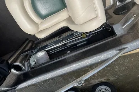 Slide: The Image of 1998 Tracker Targa 185 Sport boat interior with storage compartment and seating. - 10