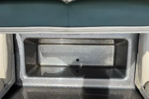 Slide: The Image of Storage compartment in a 1998 Tracker Targa 185 Sport boat, featuring a sleek interior design. - 12