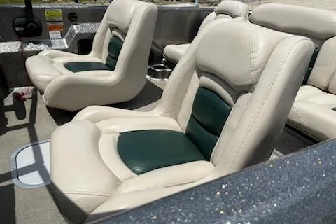 Slide: The Image of 1998 Tracker Targa 185 Sport boat interior with white and green cushioned seats. - 3