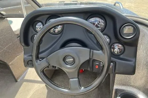 Slide: The Image of Steering wheel and dashboard of 1998 Tracker Targa 185 Sport boat. - 7