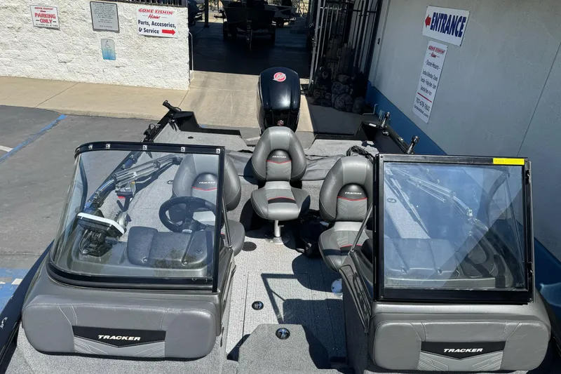 Slide: The Image of 2021 Tracker Pro Guide V-175 Combo boat interior with seating and windshield. - 10