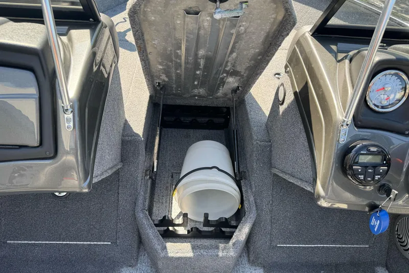 Slide: The Image of 2021 Tracker Pro Guide V-175 Combo boat interior with storage compartment open. - 11