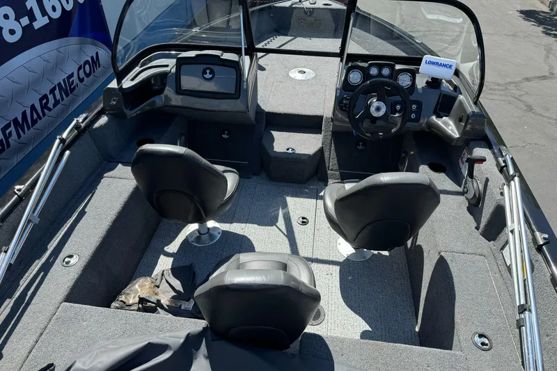 Slide: The Image of 2021 Tracker Pro Guide V-175 Combo boat interior with steering console and seating. - 7