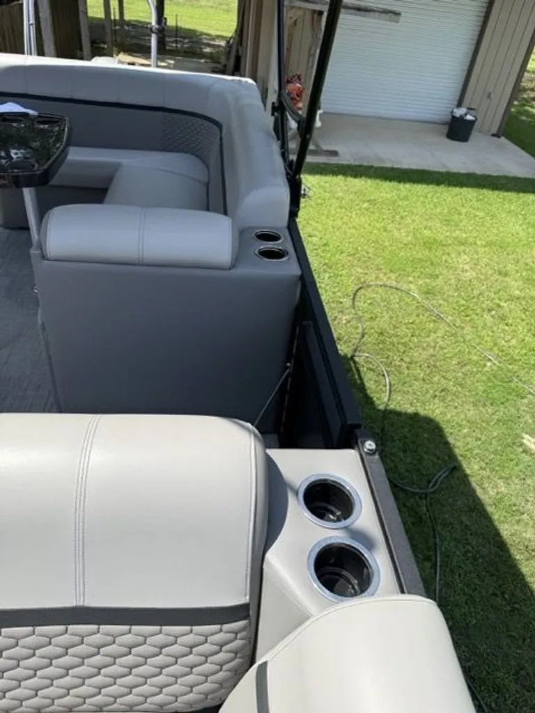 Slide: The Image of Interior of a 2022 Quest Lanai with gray seats and cup holders. - 10