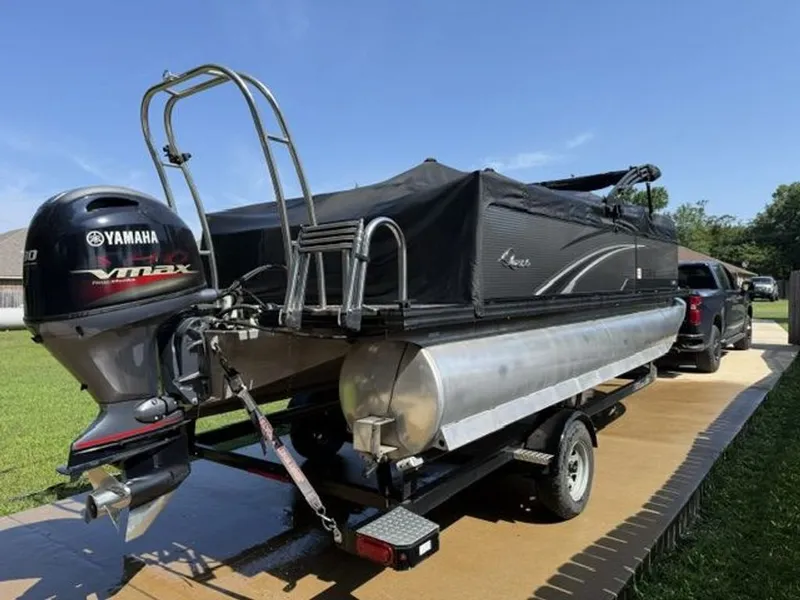 Slide: The Image of 2022 Quest Lanai pontoon boat with Yamaha Vmax engine on trailer. - 18