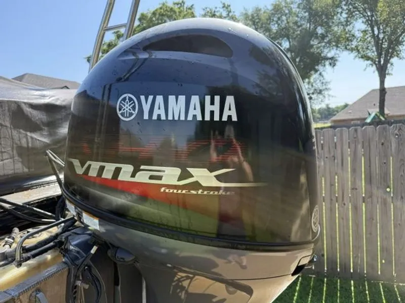 Slide: The Image of Yamaha VMAX outboard motor on a 2022 Quest Lanai boat. - 19