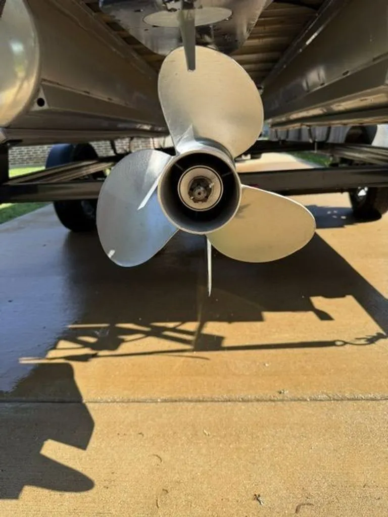 Slide: The Image of Close-up of a propeller on a 2022 Quest Lanai boat. - 21