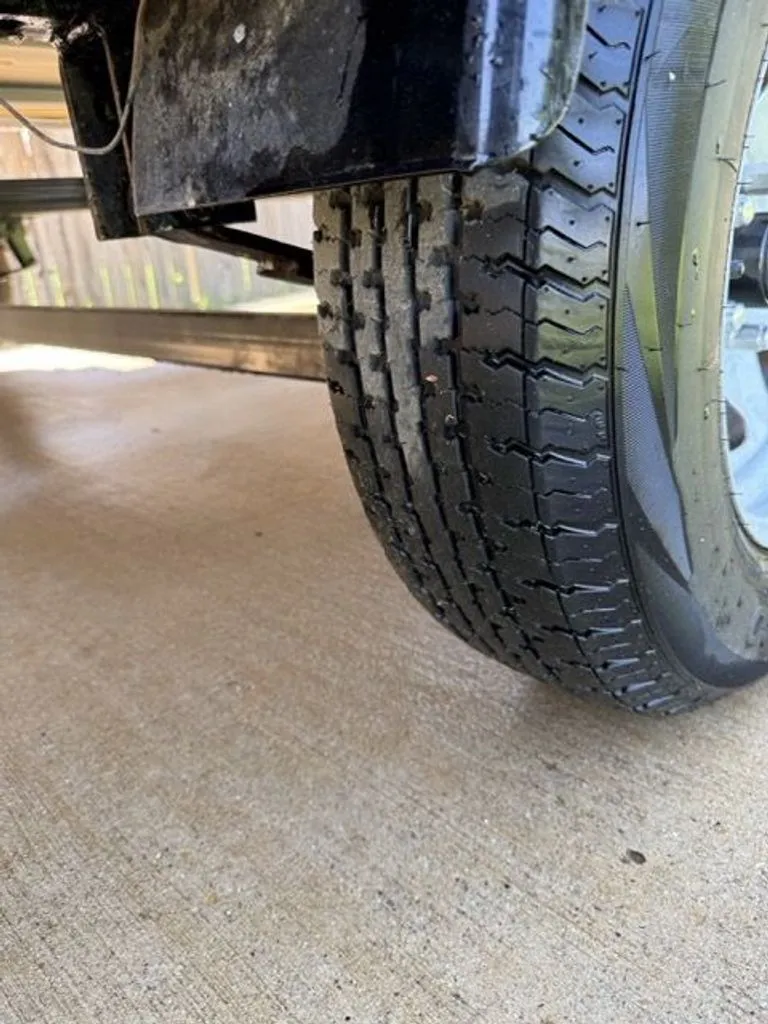 Slide: The Image of Close-up of a tire on a 2022 Quest Lanai. - 32