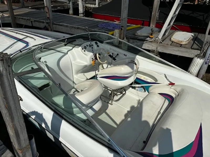 Slide: The Image of Interior of a 1995 Baja 272 boat at the dock. - 6