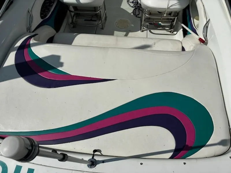 Slide: The Image of Interior of a 1995 Baja 272 boat with colorful seat design. - 8