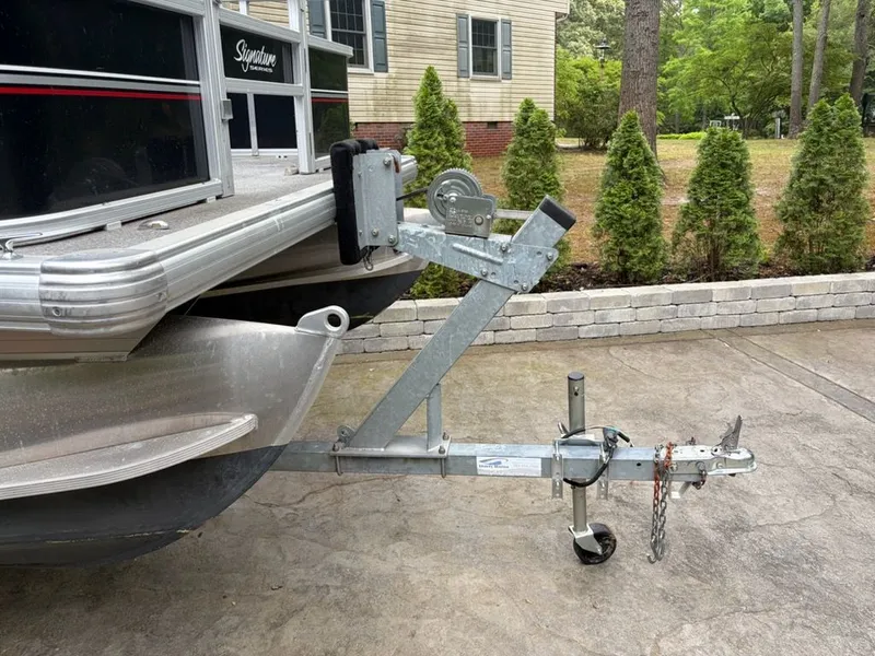 Slide: The Image of Sun Tracker BB 2016 boat trailer on concrete driveway. - 10