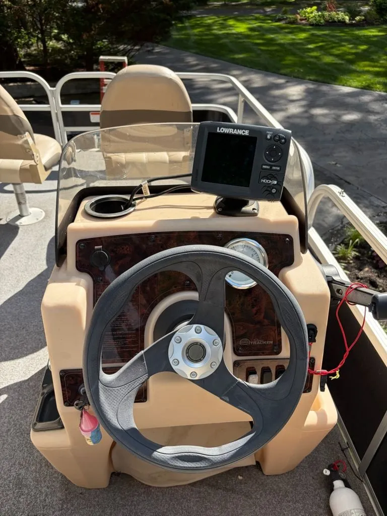 Slide: The Image of Steering console of a 2016 Sun Tracker BB boat. - 3