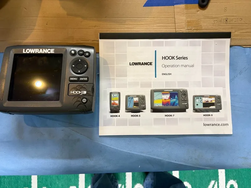 Slide: The Image of Lowrance HOOK-5 device and operation manual on blue background. - 5