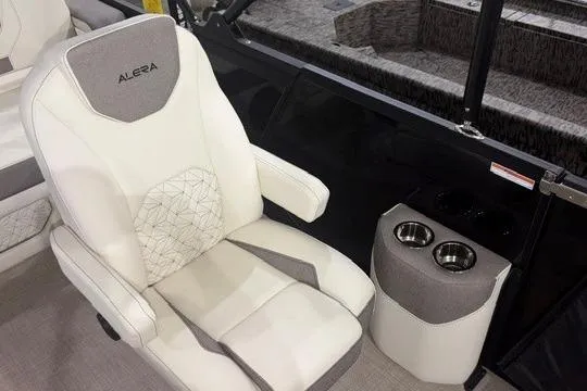 Slide: The Image of Luxurious Alera M23L 2026 boat seat with cup holders, featuring elegant white upholstery. - 2