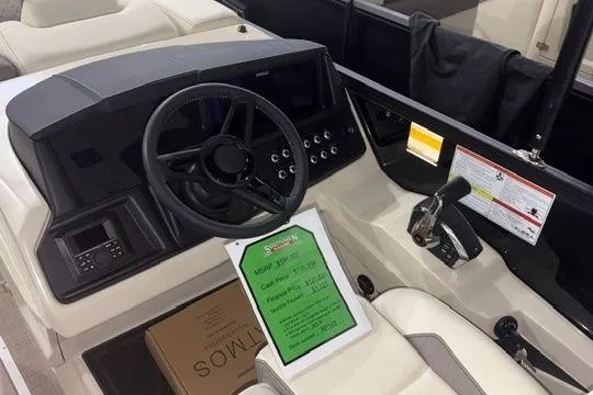 Slide: The Image of 2026 Alera M23L boat dashboard with steering wheel and control panel. - 3