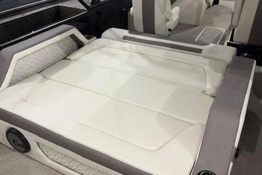 Slide: The Image of Luxurious interior seating of 2026 Alera M23L boat, featuring plush white upholstery. - 5