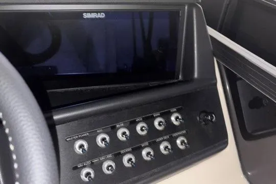 Slide: The Image of Control panel of 2026 Alera M23L boat with Simrad display and switches. - 7