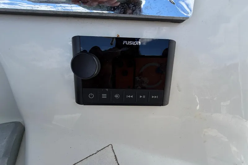 Slide: The Image of Fusion audio control panel on a 2017 Mako 284 Center Console boat. - 38